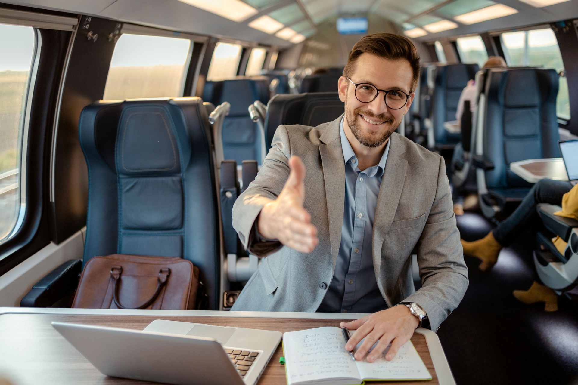 Commuter Extending His Hand for Handshake