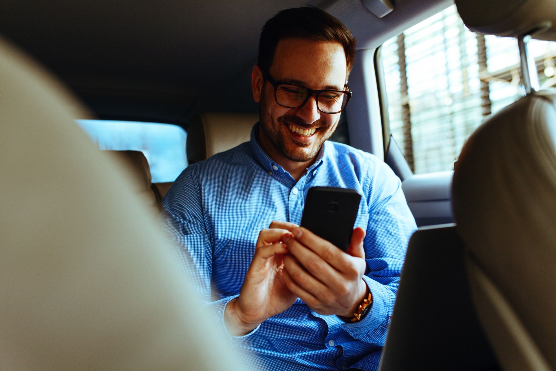 Businessman travelling in the company vehicle